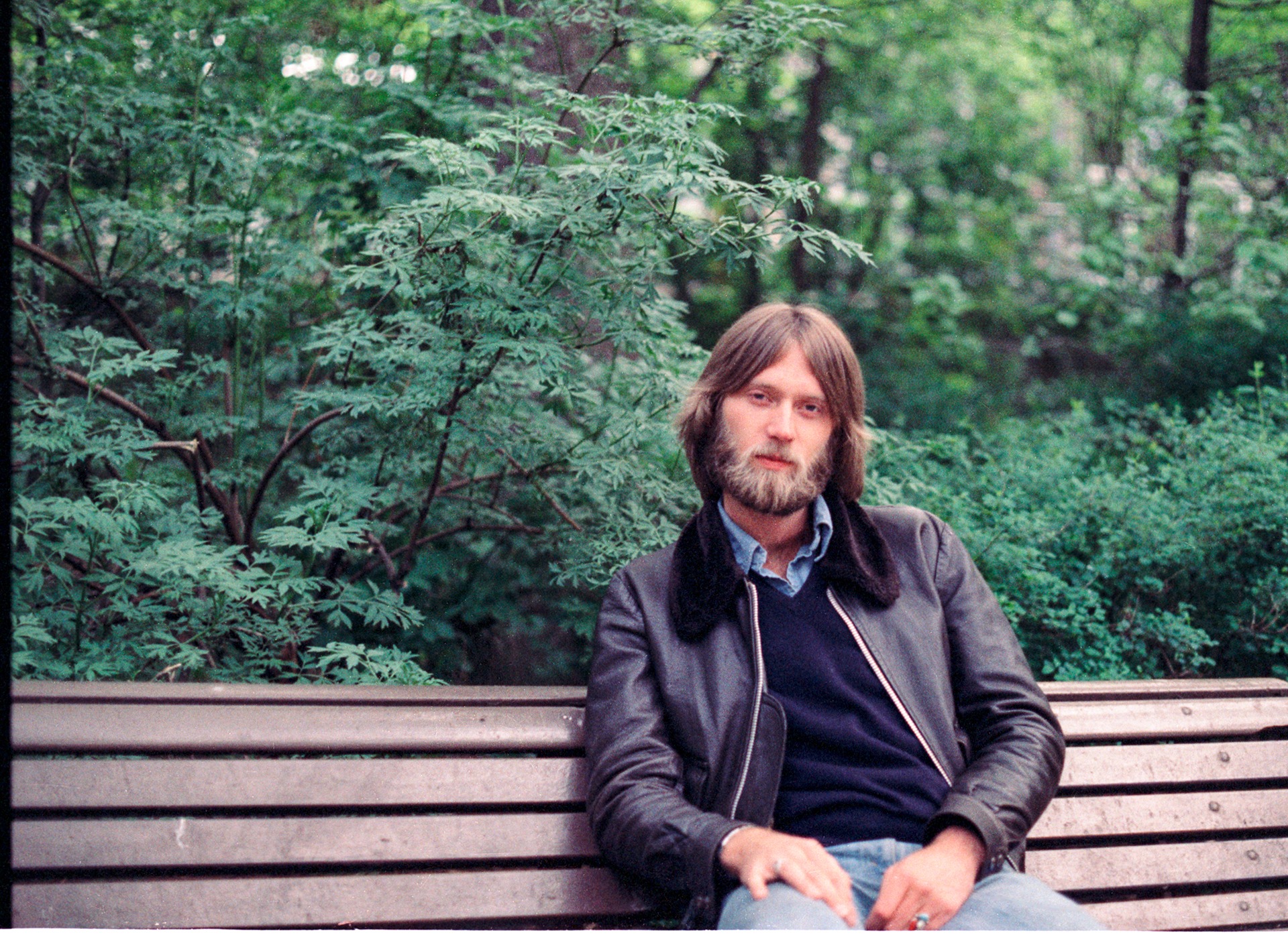 Duane seated with guardian angels on either side (unseen)