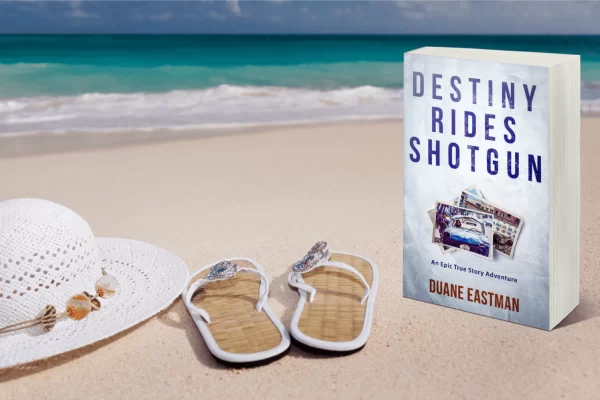 Destiny Rides Shotgun book on sandy tropical beach