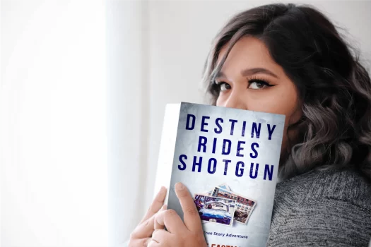 Girl holding Destiny Rides Shotgun book